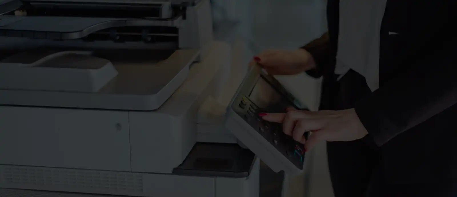 Dark image of a printer for the header.